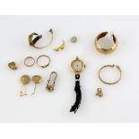Mixed group of items, Omega watch, single hoop earrings, gold rings, parts of charms, all in 9 ct,