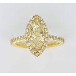 Fancy pale yellow marquise form diamond ring, the central stone estimated at 2.01 carats, clarity