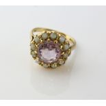 Amethyst and seed pearl cluster ring, central round cut amethyst, estimated weight 2.84 carats,