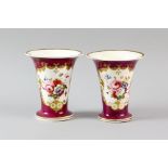 Pair of 19th century red ground trumpet vases, 12cm high .
