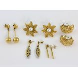 Five pairs of gold earrings, white pearl set flower studs, measuring approximately 2.1 x 2.5cm