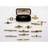 Collection of Victorian and Edwardian gold brooches, some gem set, seed pearl bow brooch boxed by