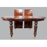 19th century mahogany extending dining table on turned reeded and tapering turned legs with