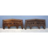 Pair of Eastern hardwood carved and peirced wall mounts, 108cm wide