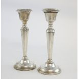 Pair of modern silver candlesticks, on tapering columns and circular beaded bases, by S J Rose &