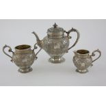George V Scottish silver tea service, comprising tea pot, cream jug and sugar bowl, with embossed
