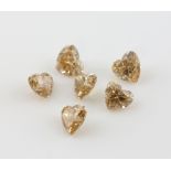 Diamonds loose six heart form champagne coloured diamonds, each weighing 0.50 carat, .