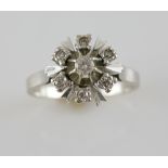 1970's cluster ring, central round brilliant cut diamond surrounded by six Swiss cut diamonds,