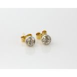 Old cut diamond studs, estimated total weight 0.70 carat, estimated colour H/I and clarity I,