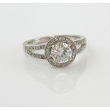 Diamond halo ring, central round brilliant cut diamond, estimated total diamond weight 1.48