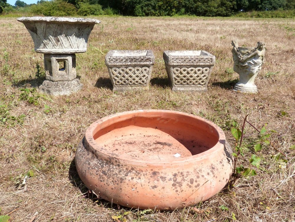 Pair of composite stone garden planters, oval garden planter, terracotta garden planter and another,