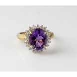 Amethyst and diamond cluster ring, oval cut amethyst, estimated weight 3.98 carats, set within a