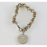 Tiffany & Co, a silver bracelet with label' Please Return to Tiffany New York' , London hallmarks