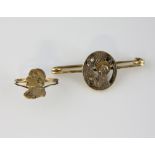 Oval cathedral scene bar brooch, central pierced panel depicts angel visiting priest, mounted in