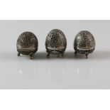Indian white metal pepperettes with elephant, tiger and leaping hare on ball feet.