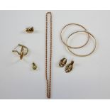 A group of gold jewellery, a pair of hoop earrings set with yellow garnet, a rose gold chain, two