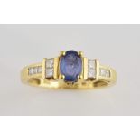 Sapphire and diamond ring, oval cut sapphire, estimated weight 0.80 carats, with princess cut