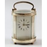 Silver plated and glass oval carriage clock 15 cm