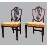 Set of twelve 19th century style mahogany sheild back dining chairs with padded seats on square legs