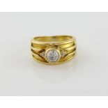 Vintage diamond ring set with central stone estimated at 0.60 carat, with two small diamonds set