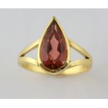Gold ring set with a pear shaped pink tourmaline in 18 ct gold, ring size V .