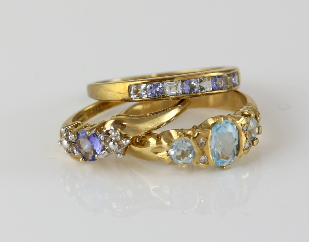 Three gem set rings, blue topaz and diamond ring, with a central oval cut and two round cut blue - Image 3 of 4