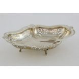 Modern silver dish with pierced foliate decoration on four shaped feet, by Viner's Ltd.,