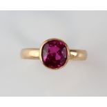 Cushion cut synthetic pink sapphire ring, estimated weight 3.00 carats, mounted in yellow metal