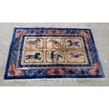Chinese blue ground rug decorated with horses, 192cm x 120cm