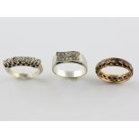 Mixed group of rings, double row wave ring set with round brilliant cut diamonds, mounted in white