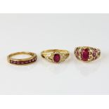 Three rings, oval ruby diamond set shoulders, size W, with a vintage ruby and diamond dress ring,