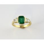 Emerald and diamond ring, step cut emerald, estimated weight 1.21 carats, set with four baguette cut