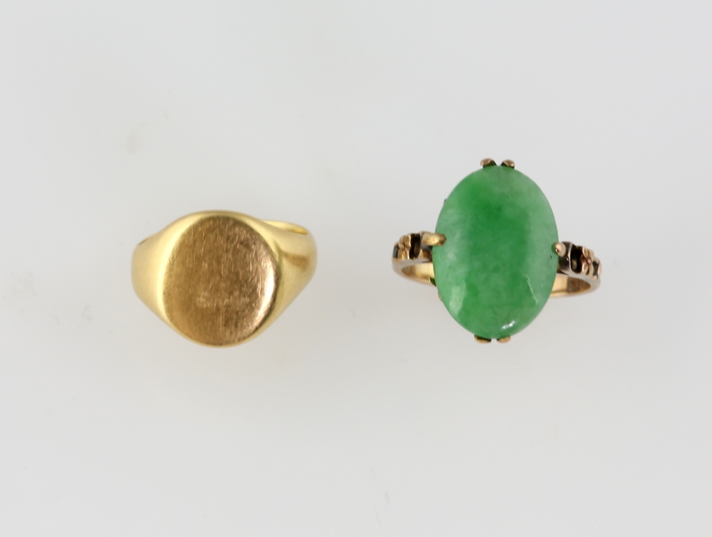 Oval gold signet ring, in 18 ct, size G and a jade ring, oval cabochon cut stone measuring 16 x