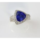 Tanzanite cluster ring, trillion cut tanzanite estimated weight 2.60 carats, surrounded by round