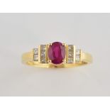 Ruby and diamond dress ring, central oval cut ruby, estimated weight 1.00 carat, set with princess