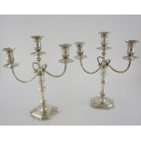 Pair of George V silver three light candelabra, with knopped stems on shaped square bases, by