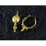 Roman gold earrings,1 st Century AD, comprised of discs, with wirework border the fine band