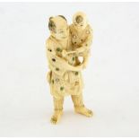 19th Century Japanese ivory figure of a man carrying a child, 9 cm,PLEASE NOTE: THIS ITEM CONTAINS