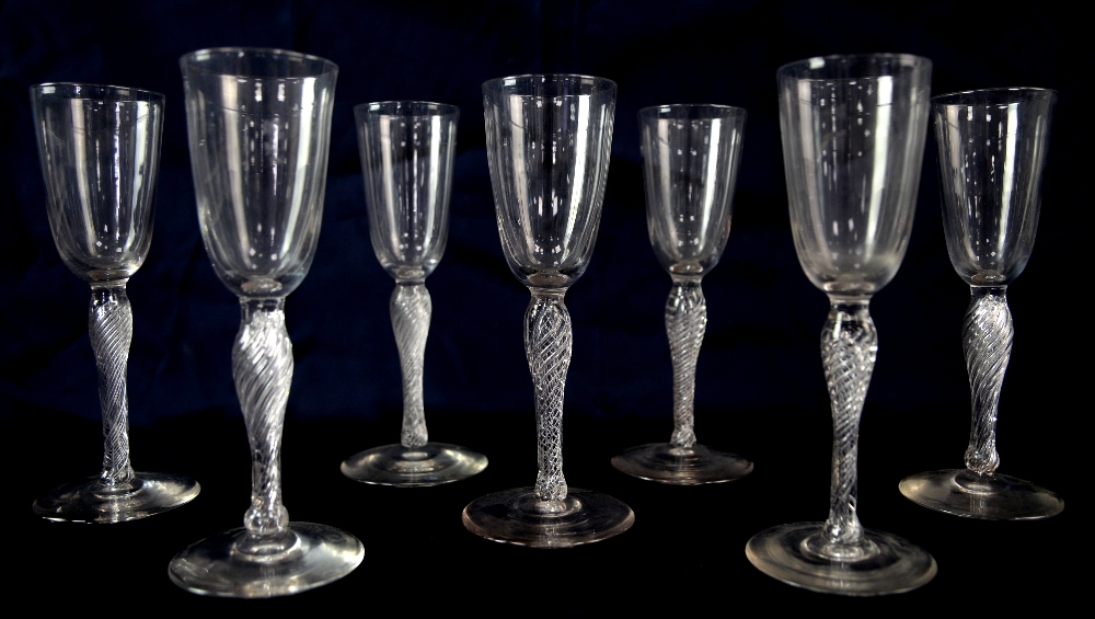 Set of seven early 20th century champagne flutes, with air-twist stems, 17 cm high.