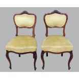 Set of six Victorian walnut dining chairs with carved back rails and serpentine seats on cabriole