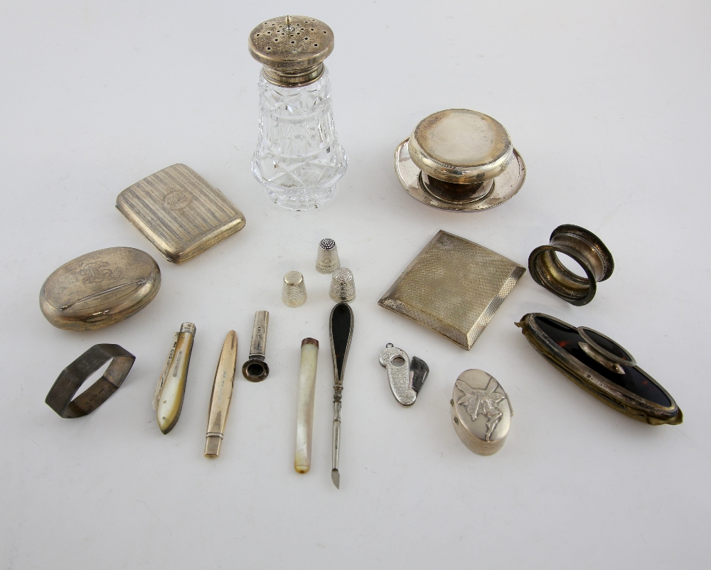 Group of silver and silver-mounted items including a snuff box, two cigarette boxes, napkin rings, a