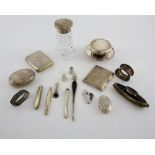 Group of silver and silver-mounted items including a snuff box, two cigarette boxes, napkin rings, a
