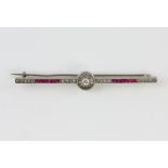 Art Deco ruby and diamond bar brooch, central old cut diamond set in circular border with square cut