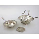 George V silver basket with pierced decoration and fixed handle, on four shaped feet, by Martin Hall