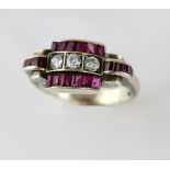 1940's diamond and ruby ring, central panel of three old cut diamonds, estimated total weight 0.30
