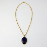 Oval cabochon cut lapis lazuli pendant, estimated weight 24.88 carats, with fancy link chain,