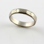 Engraved wedding band, twelve sided ring, mounted in white metal stamped platinum, size J. Gross