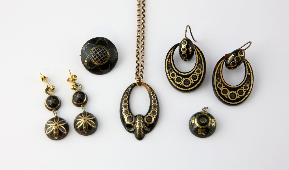 Victorian tortoiseshell pique jewellery, oval pendant with floral detailing, measuring approximately