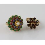 Two vintage rings, with floral settings, one with central round opal, surrounded by a border of