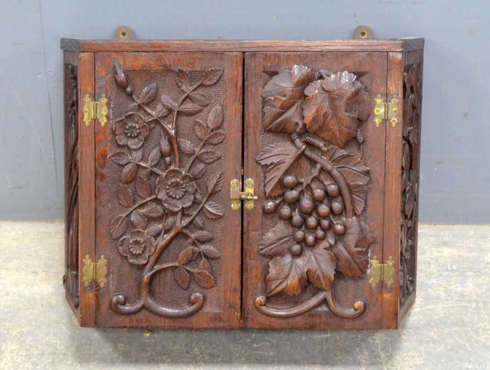 Black Forest style carved oak wall hanging corner cupboard with flowers and vines, 38cm x 50cm. - Image 2 of 3